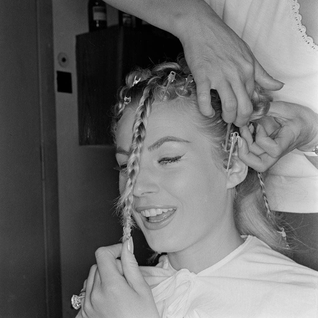 #64 Anita Ekberg getting ready for a shoot, 1959.
