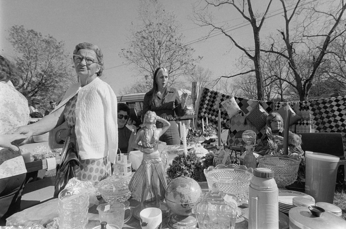 #23 Junk table with women, 1975 Nov