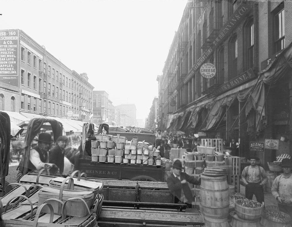 #10 View of the merchants and passersby at the South Water Street Market in Chicago, 1910s.