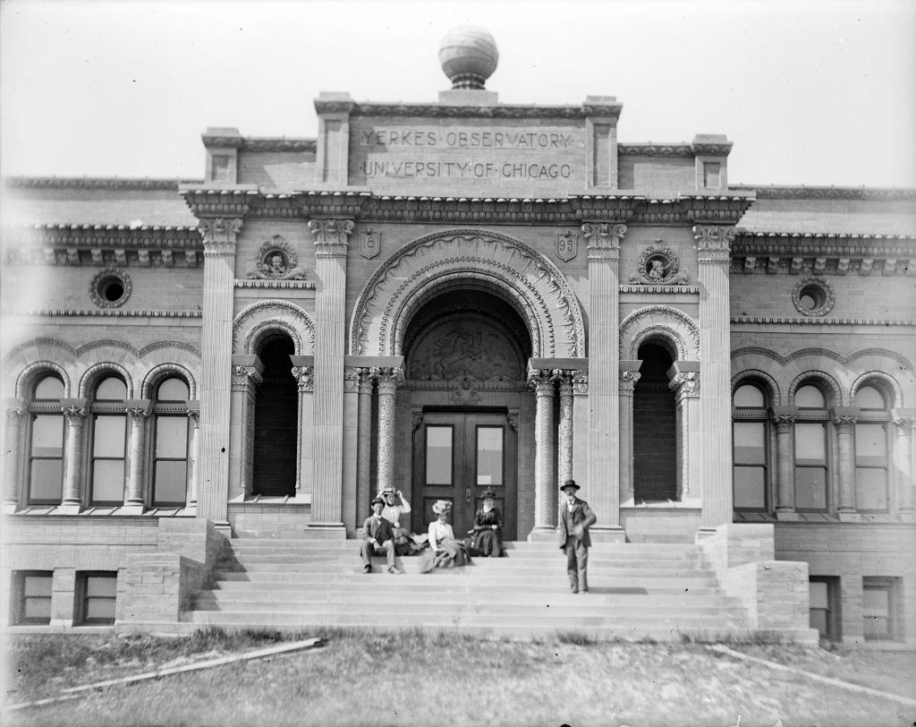 #29 A group portrait of three women and two men outdoors on the steps of the Yerkes Observatory, a facility of the University of Chicago, 1910s.