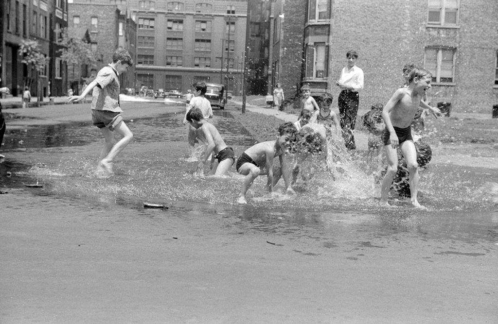 #56 Children playing in water from hydant. Chicago 1914.