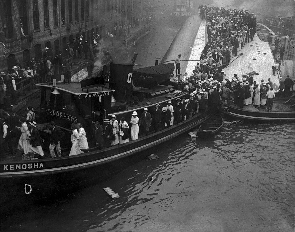 #62 Survivors of the Eastland being lead ashore by the tugboat Kenosha. Chicago, 1915.