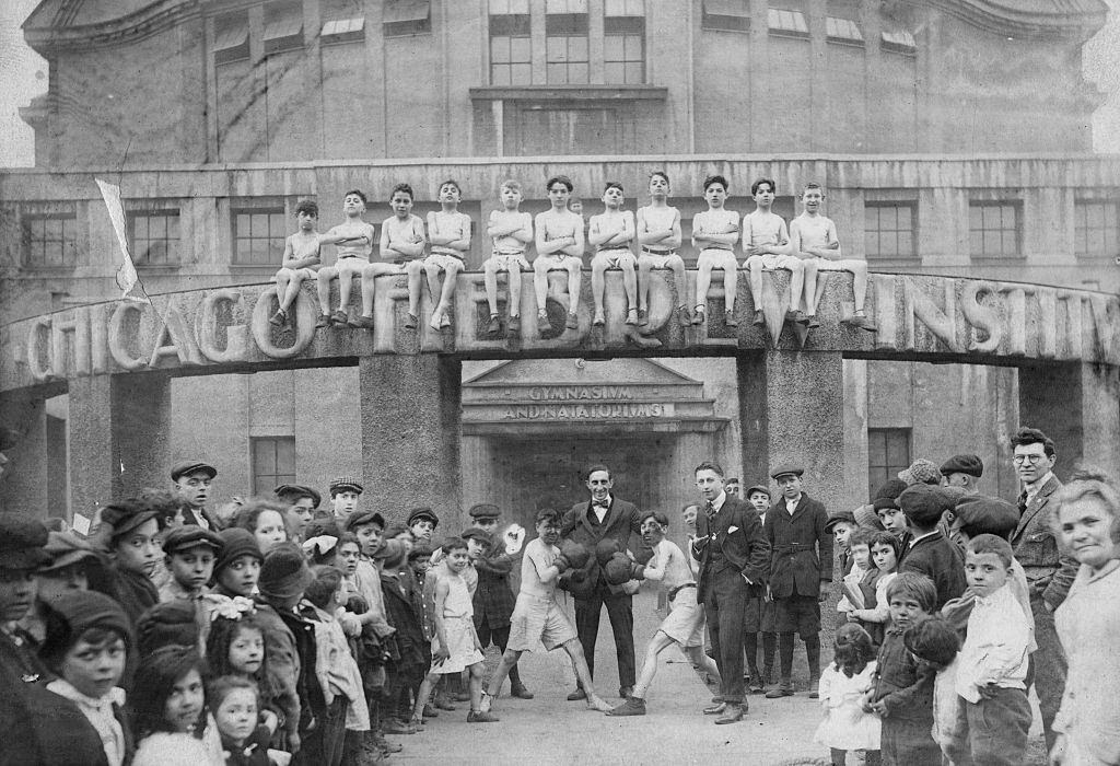 #63 Boys boxing in front of Chicago Hebrew Institute gymnasium and natatorium at Taylor and Lytle Streets in Chicago, 1915.