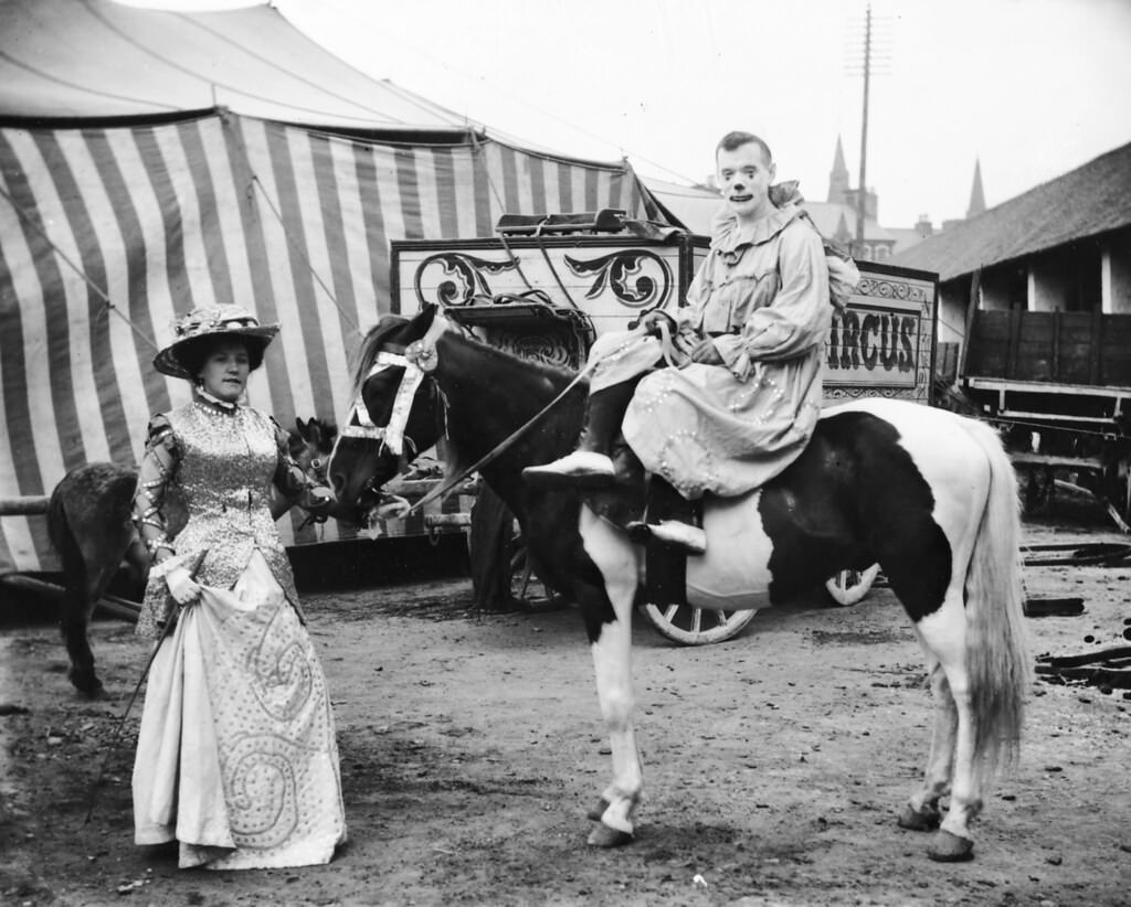 #17 Clown on a horse, while a lady holding the horse, 1910.