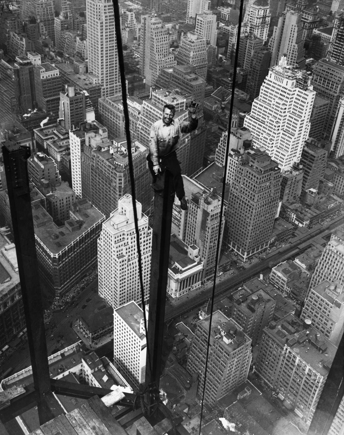 #2 Carl Russell waves to his co-workers on the structural work of the 88th floor of the new Empire State Building.