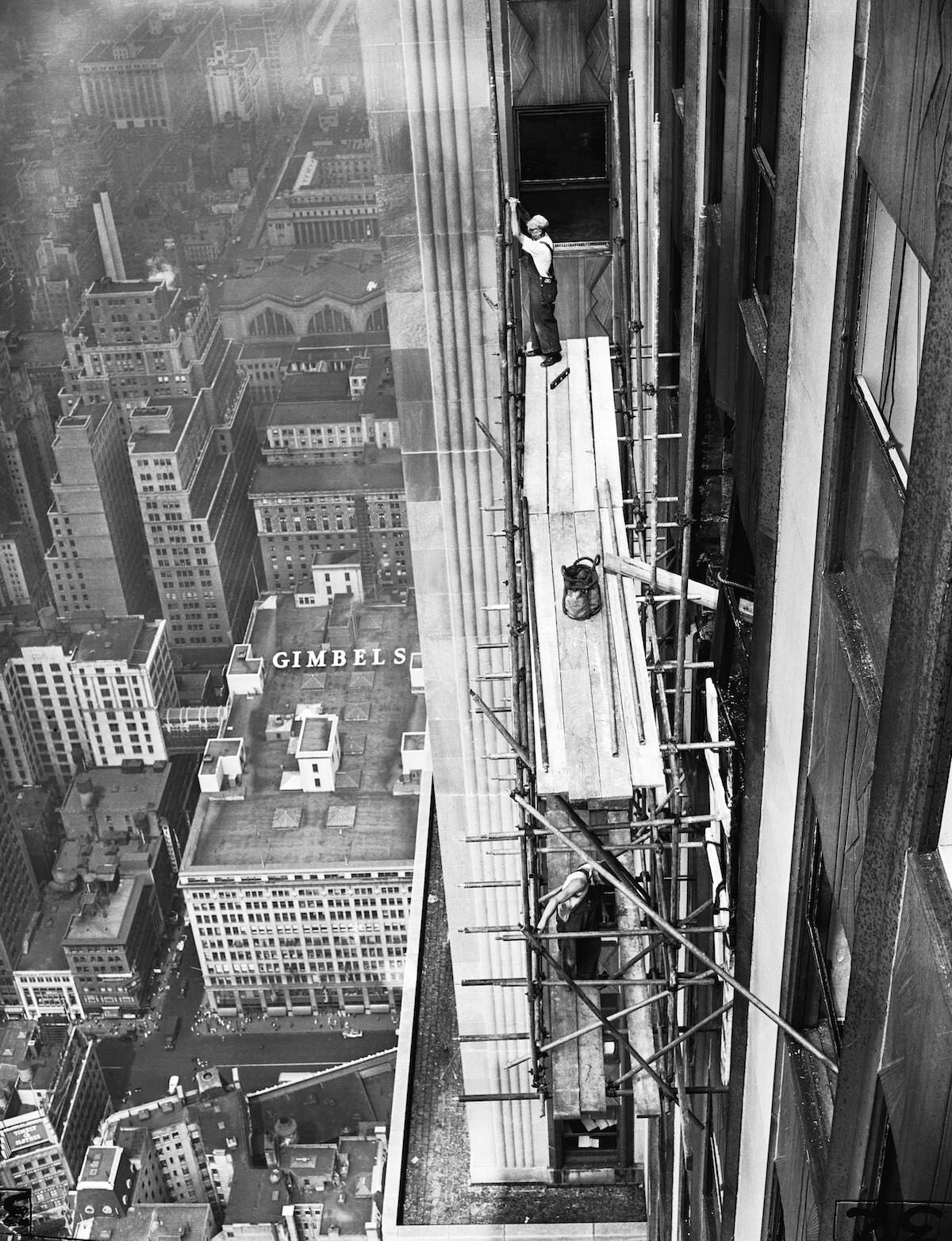 #19 Workmen erect scaffolding on the 33rd Street Side of the Empire State Building as reconstruction work on the skyscraper begins.