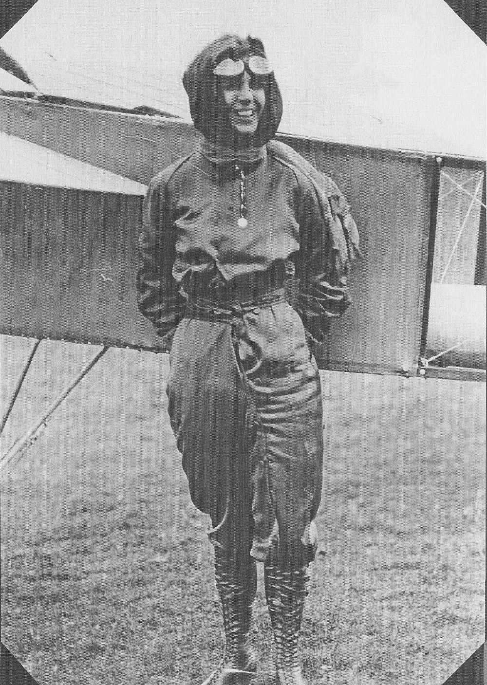 #11 Harriet designed this outfit, in rich purple, to eliminate the indignity of an exposed ankle while clambering aboard an aeroplane.