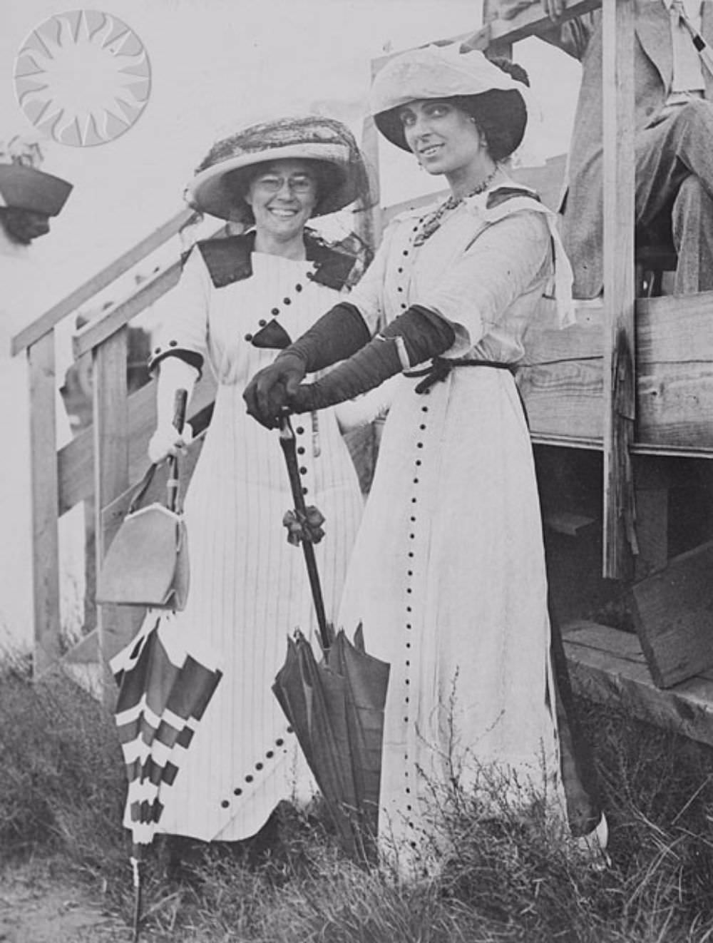 #16 Matilde Moisant (left) poses with Harriet Quimby (right), circa 1911-1912.