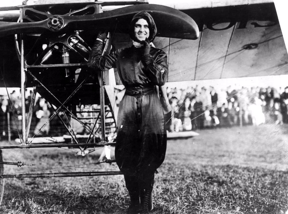 #5 Harriet Quimby in her purple flight suit.