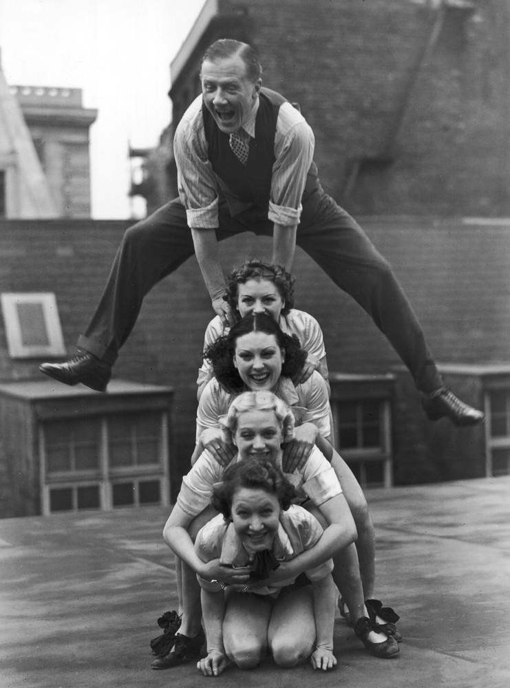 Jack Payne, the British dancer, pictured rehearsing with his troupe, ‘Manhattan Six’ on the roof of the Holborn Empire, 1938.