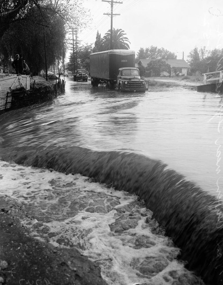 #6 Water flowing through roads, Culver Boulevard. November 1952.