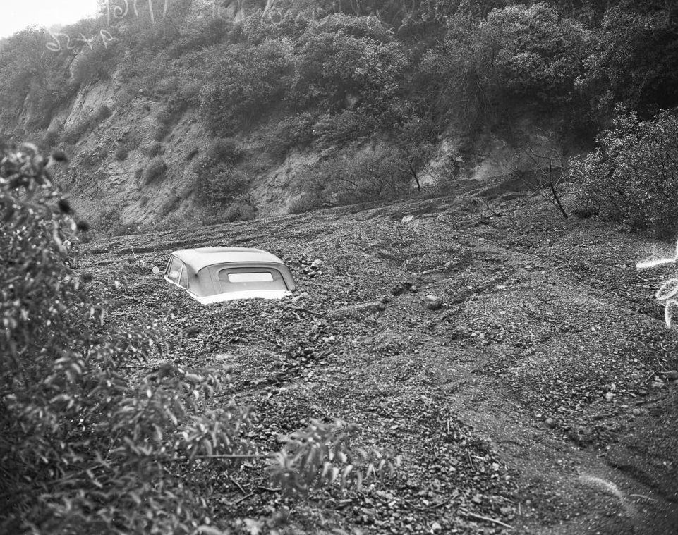 #13 Top of buried car after a landslide at Mulholland Drive, Los Angeles. 16 January 1952.