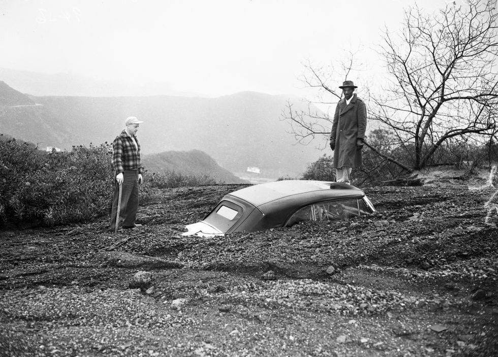 #16 A half-buried car in Van Nuys. 16 January 1952.