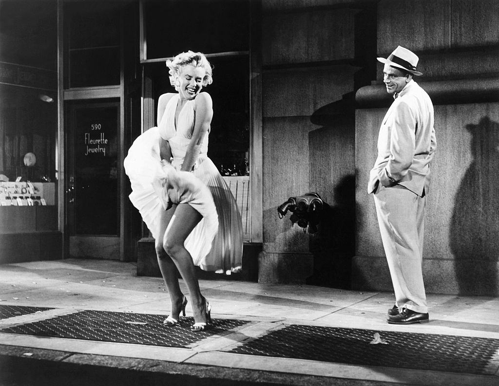 #10 Marilyn Monroe and actor Tom Ewell on the set of The Seven Year Itch.
