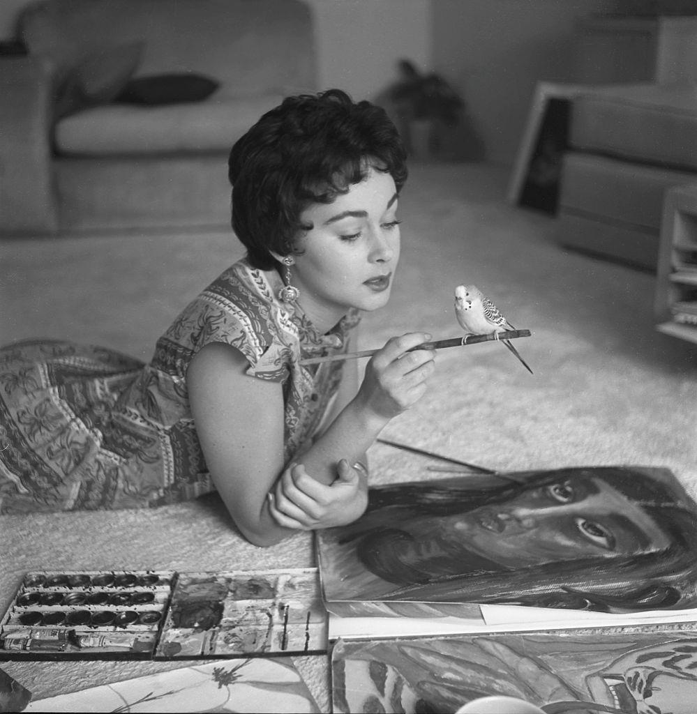 #17 Marla English with her parrot, 1954.