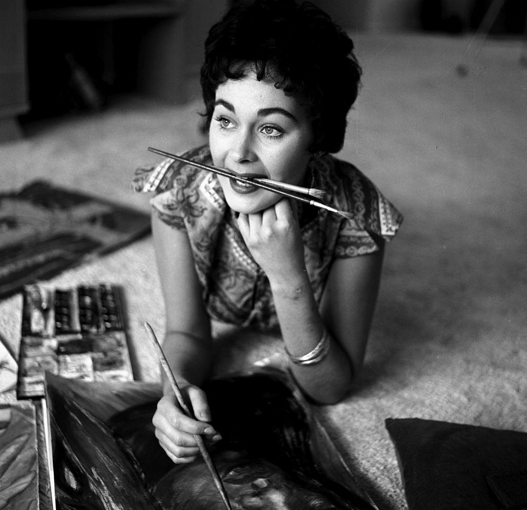 #20 Marla English painting in her home, 1954.