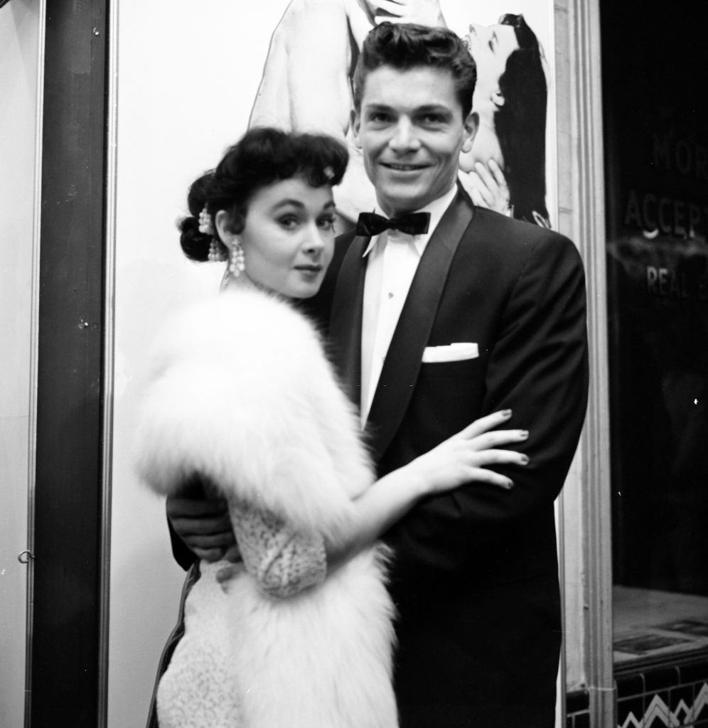 #25 Marla English poses with Larry Pennell at the premier of “The Rose Tattoo”, 1955.