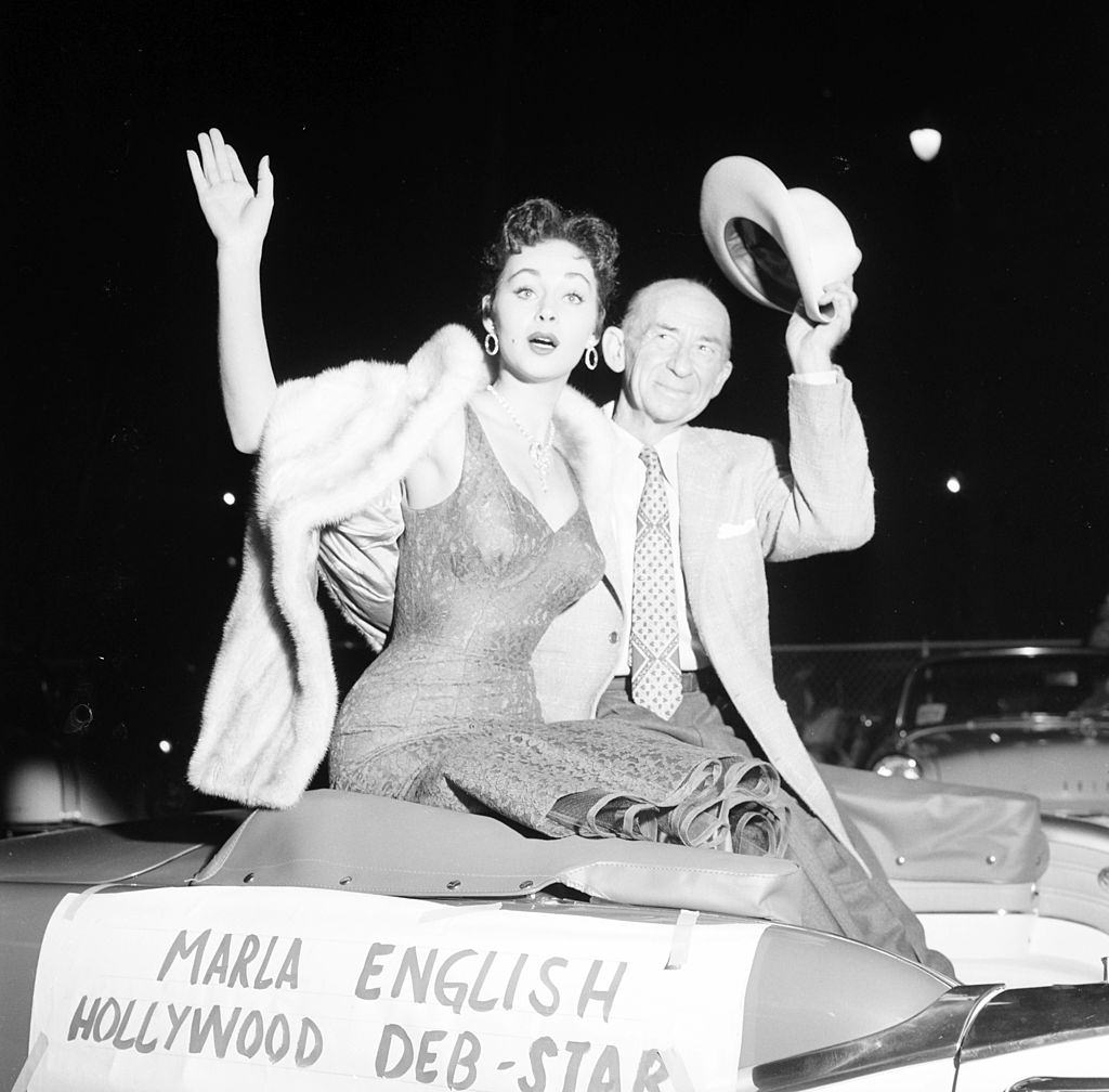 #28 Marla English waves with Roscoe Ayes as the Hollywood Deb-Star in Los Angeles, 1955.