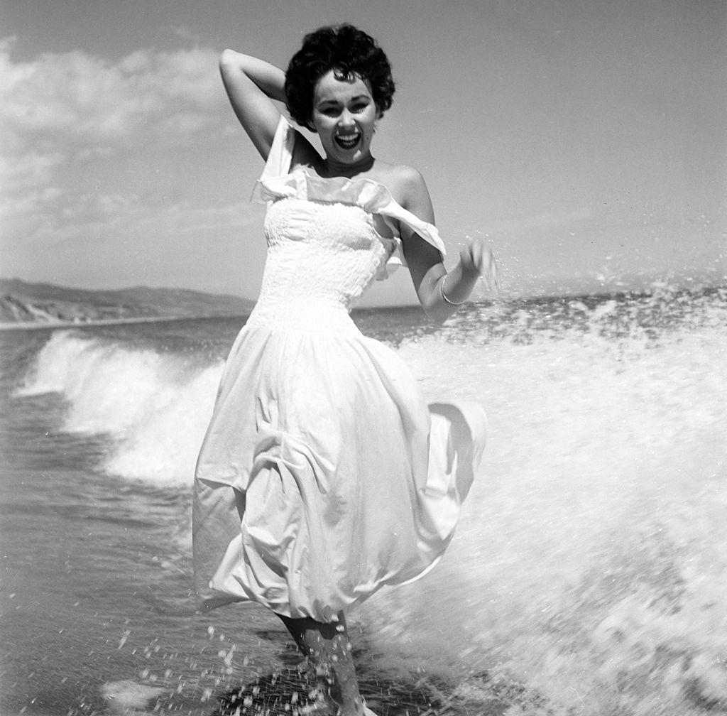 #30 Marla English enjoying on the beach, 1954.