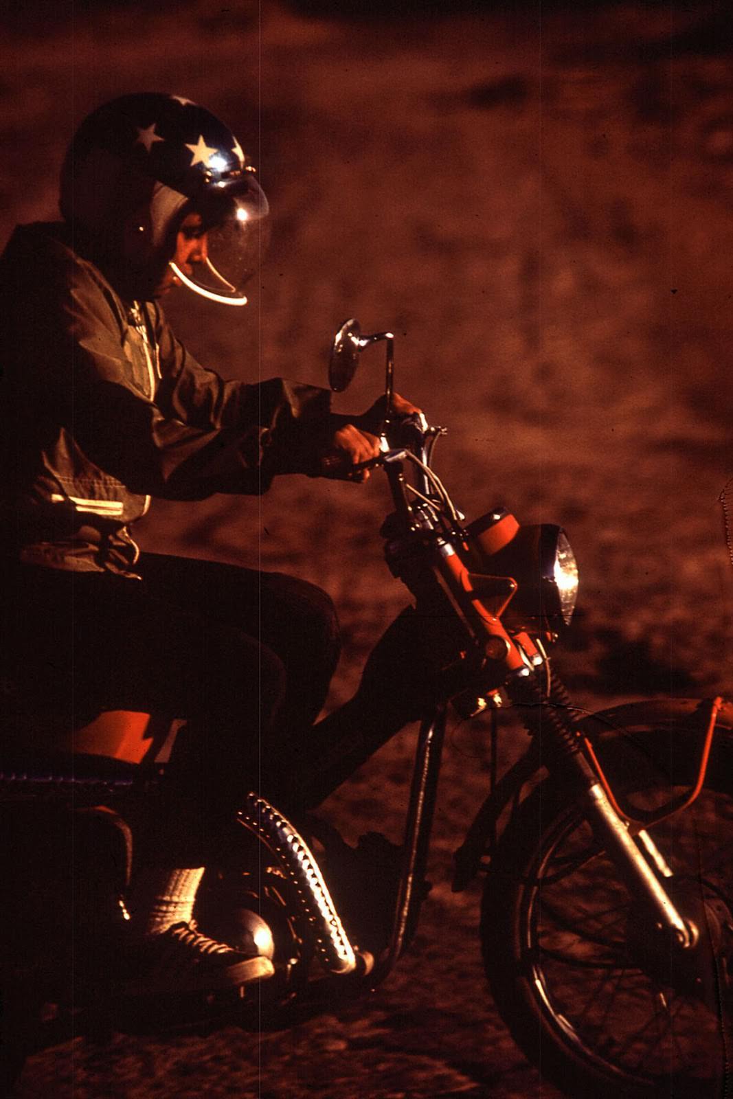 #33 A young Navajo rides a motorcycle in Window Rock, Arizona.