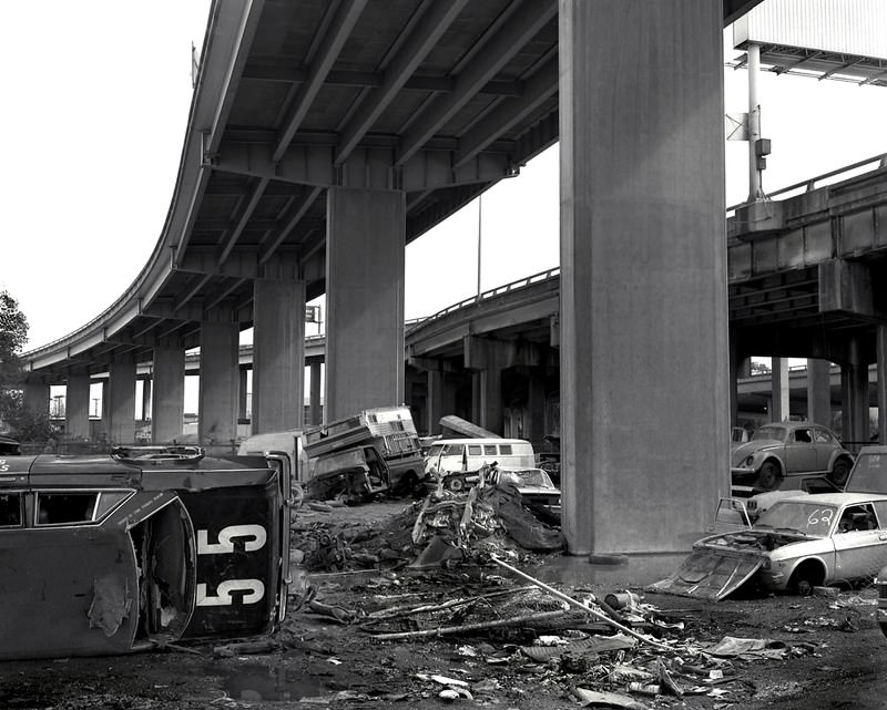 #14 Automobile graveyard beneath the Nimitz Freeway, near 34th St and Wood, Oakland, 1986.