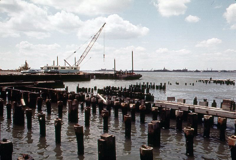 #20 Ellis Island and industrial Jersey City shoreline across the Hudson with abandoned CRRNJ railroad terminal, June 1973