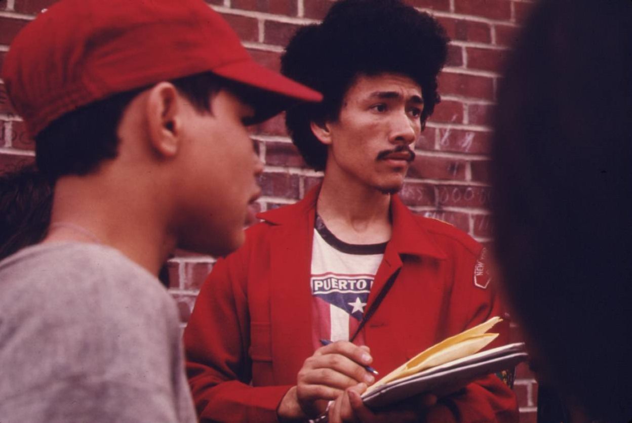 #63 Boy scout leader recruiting among Latin Youths Bedford Stuyvesant district of Brooklyn, June 1974.