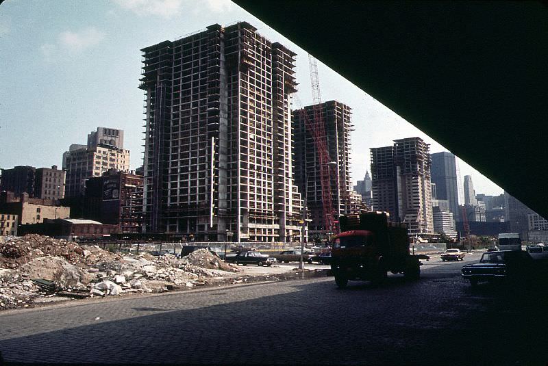 #1 Construction of Independence Plaza North, cobblestoned West Street and Lower Manhattan from under the elevated West Side Highway, New York, June 1973