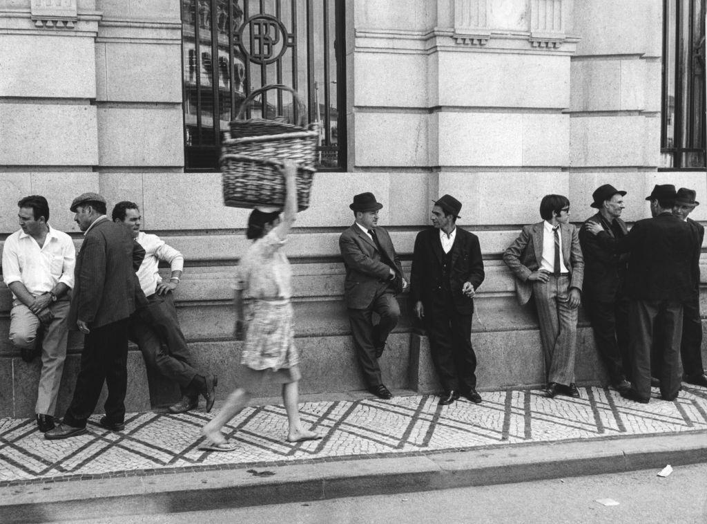 #11 Group of men on the street in Lisbon, Portugal, 1970.