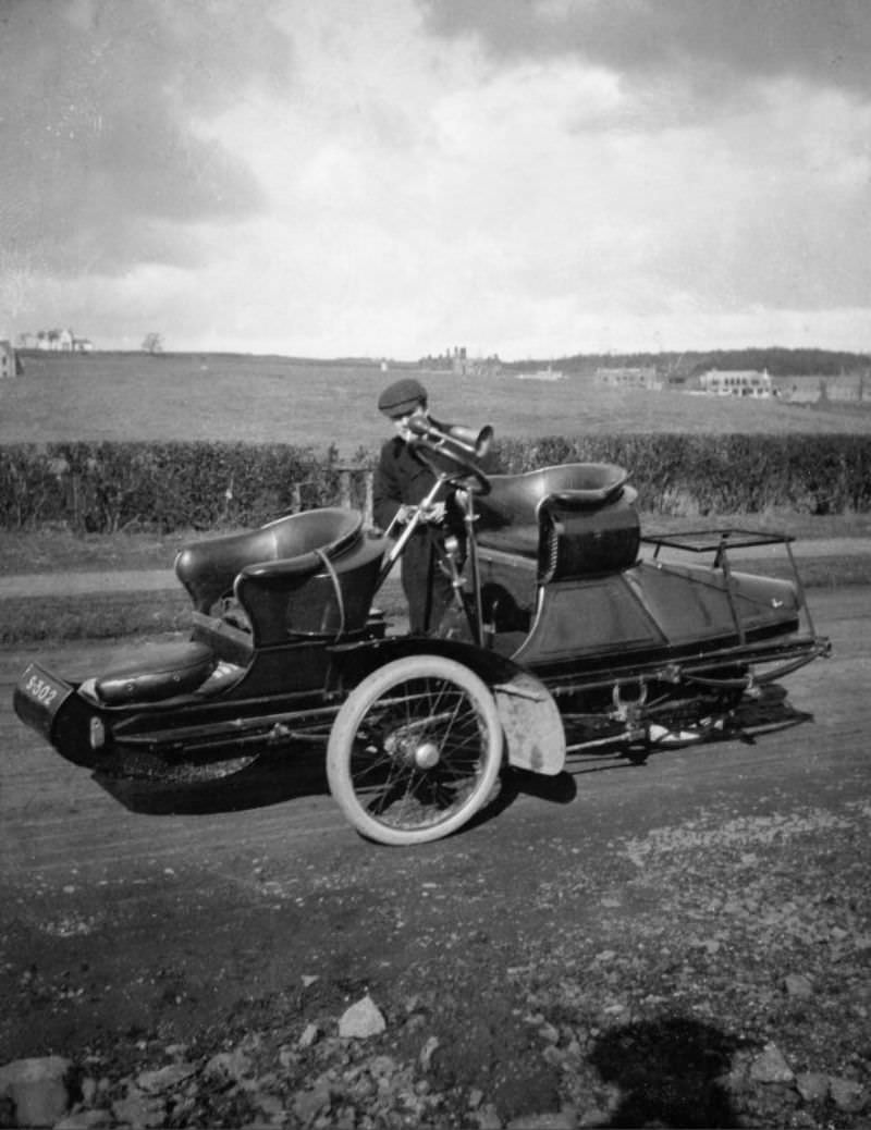 #19 Side view of possible steam car with man, c.1906.