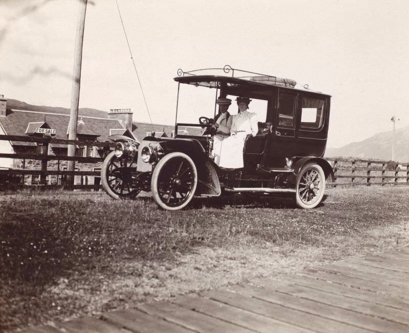 #58 Two women in a car, c.1910.