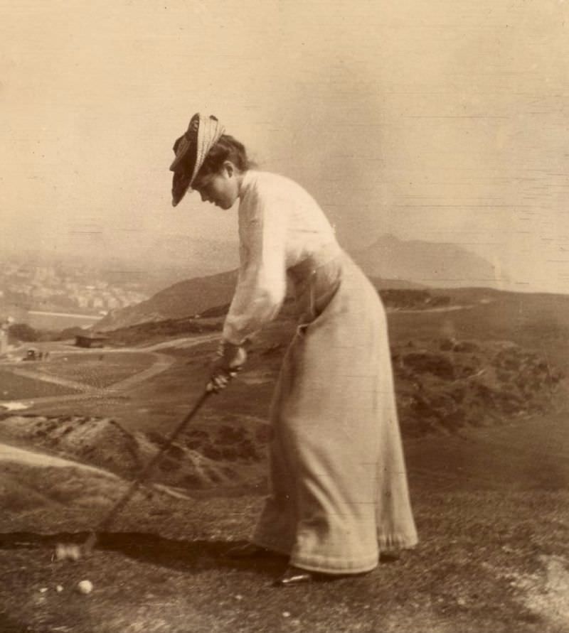 #70 Woman playing golf, 1902. Titled: ‘F.J.T Braid Hills 1902’.