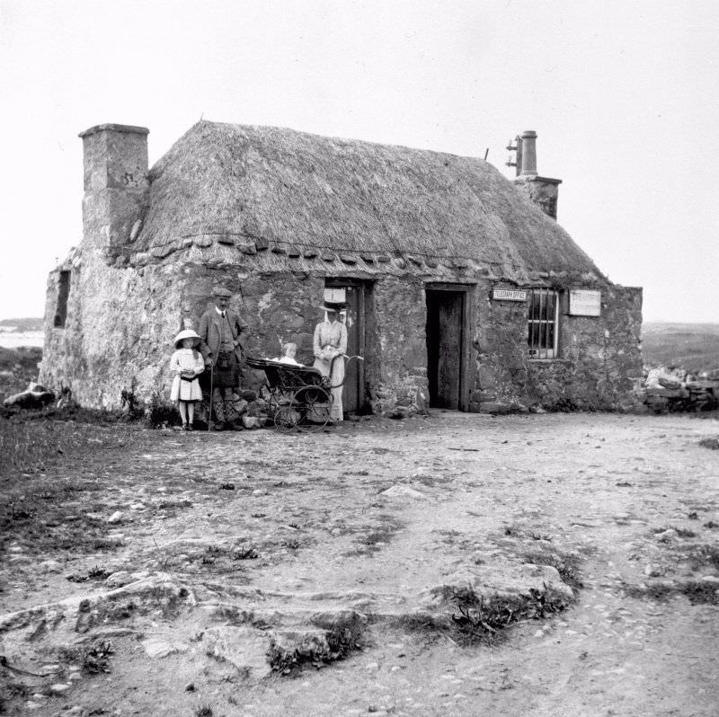 #7 View of telegraph office at Creagorry, Benbecula, with family, 1910.