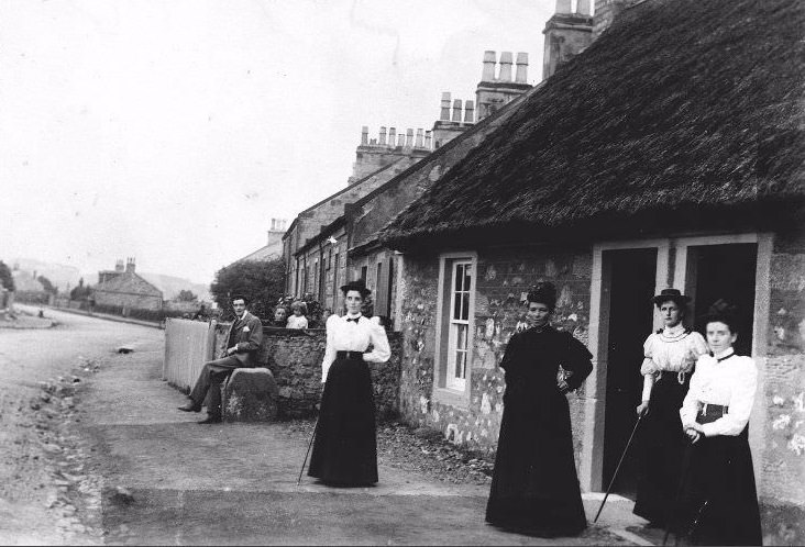 #8 People outside cottages at Troon, South Ayrshire, with thatched cottage in foreground, c.1910.
