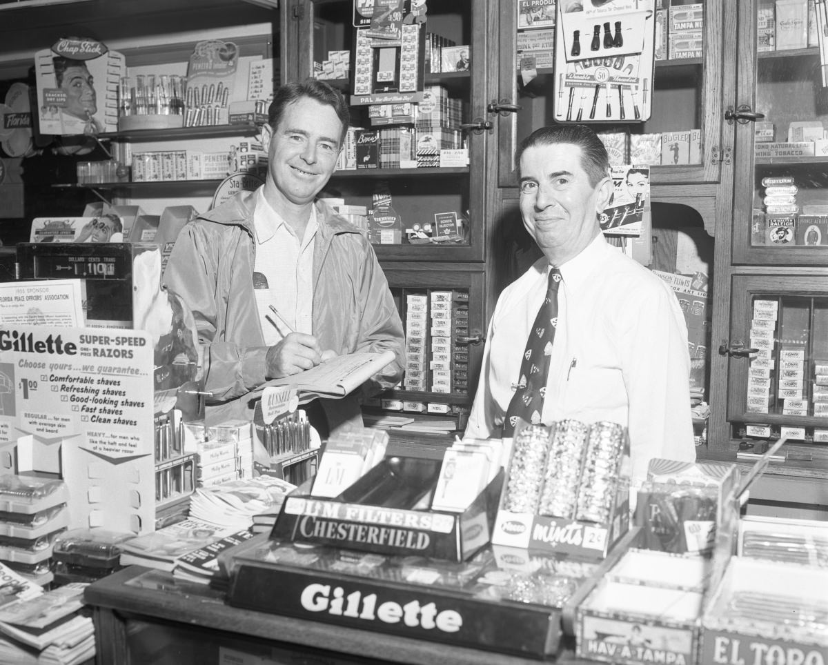 #14 Dennis Christie and salesman at a Tallahassee business – October 17, 1955