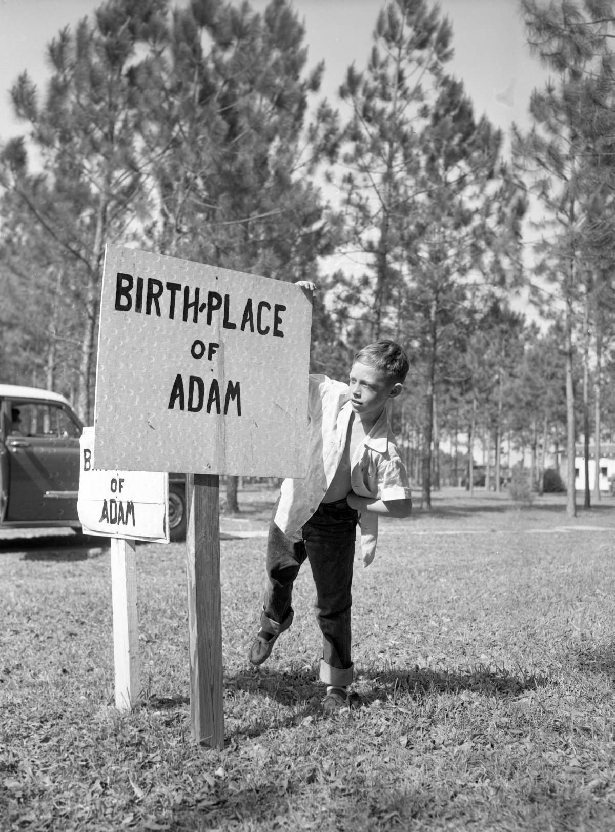#11 Joe Kerce reading sign marking the “birthplace of Adam” in the Garden of Eden