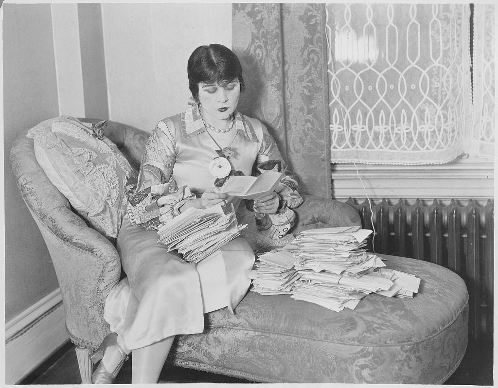 #16 Theda Bara reading her Fans Letters, 1926.