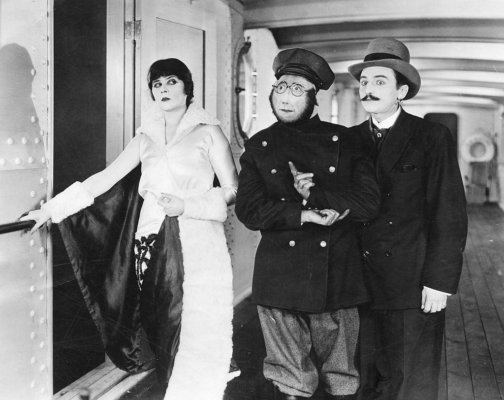#19 Theda Bara with Jimmie Finlayson and Tyler Brooke in her last movie ‘Madame Mystery’, 1926.