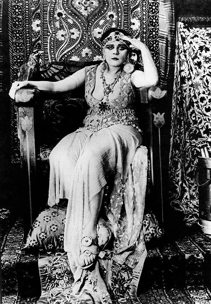 #6 Theda Bara as Cleopatra sitting on a throne in the film Cleopatra. 1917