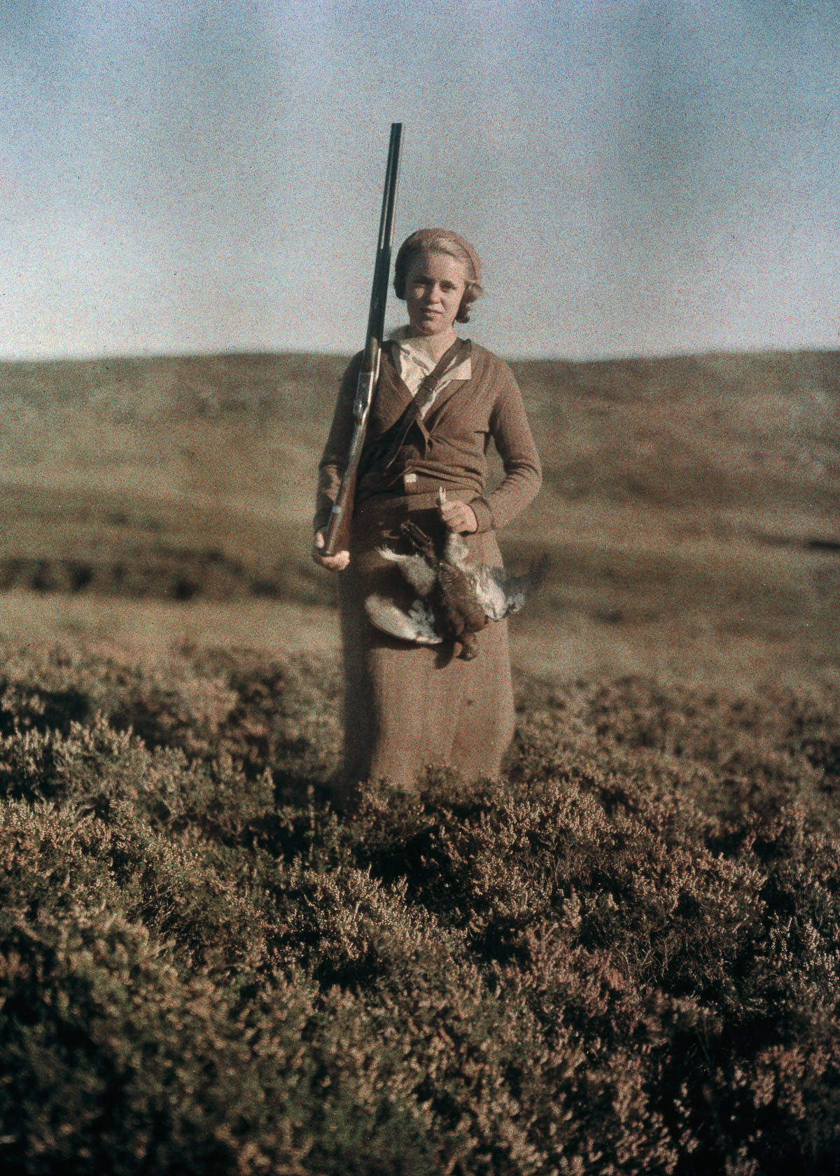 #33 Eva poses after a successful hunt in Scotland.c. 1925