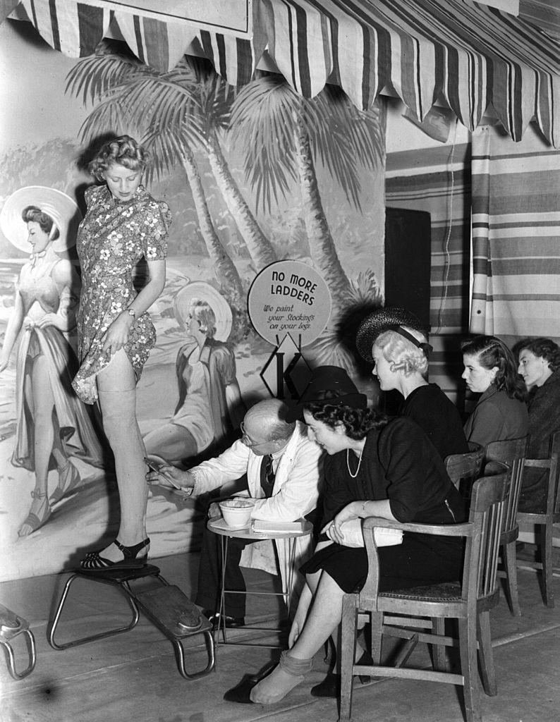 #1 A shoe store offering a service by painting stockings on women’s legs during the clothing rationing of World War II.