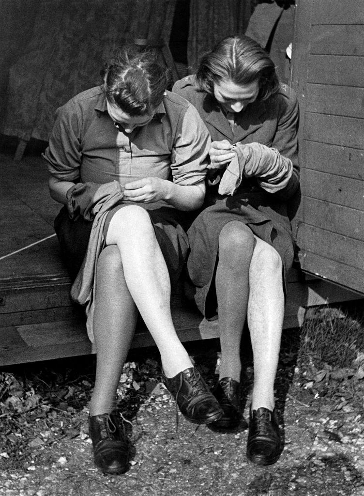 #14 Mending their stocking at training and reception Depot for ATS girls in Aldermaston, Berkshire. April 1941.