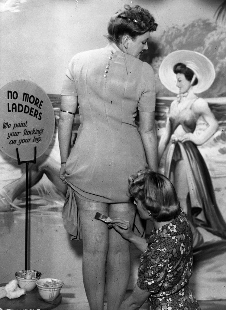 #19 A beautician at the newly-opened Bare Leg Beauty Bar at Kennard’s store in Croydon paints stockings onto a customer’s skin.