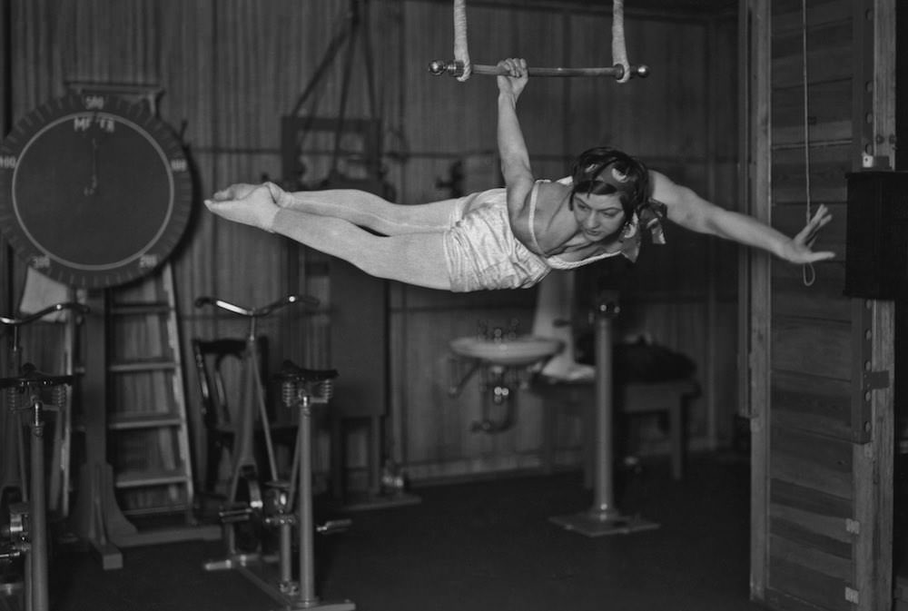 #10 A woman using an apparatus in the gymnasium of the ocean liner S.S. Bremen.1930s