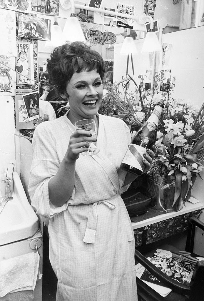 #13 Judi Dench in her dressing room after the successful first night of the musical “Cabaret”, 1965.