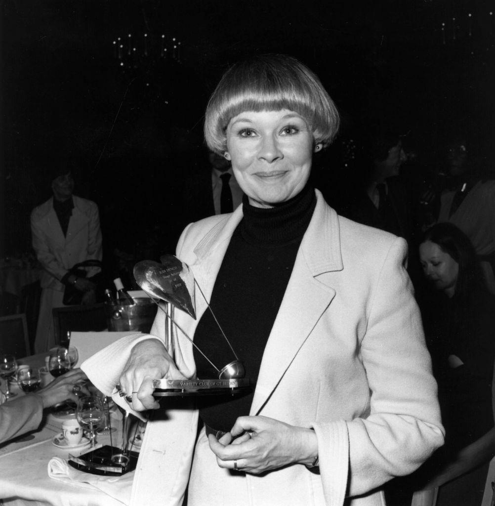 #35 Judi Dench receiving one of her many awards, 1979.