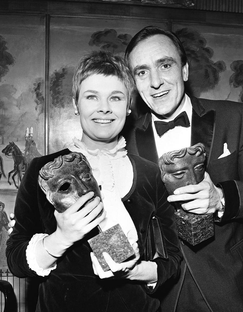 #12 Judi Dench and actor Eric Porter with their British Academy for Film and Television Arts awards, 1967.