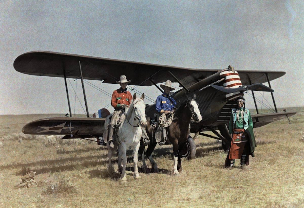 #1 Three men stand in front of a plane on the Crowe Reservation in Montana.