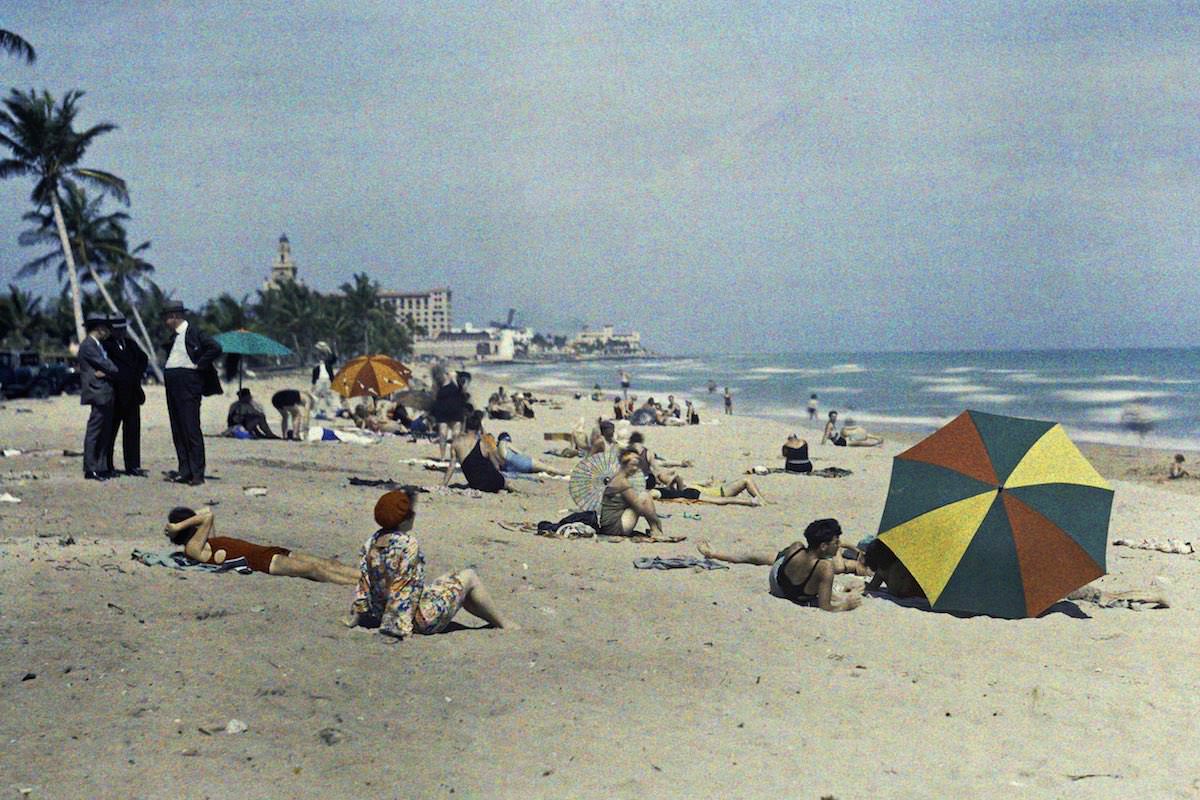 #19 A group of people relaxing on the ocean coast, Miami Beach, Florida.