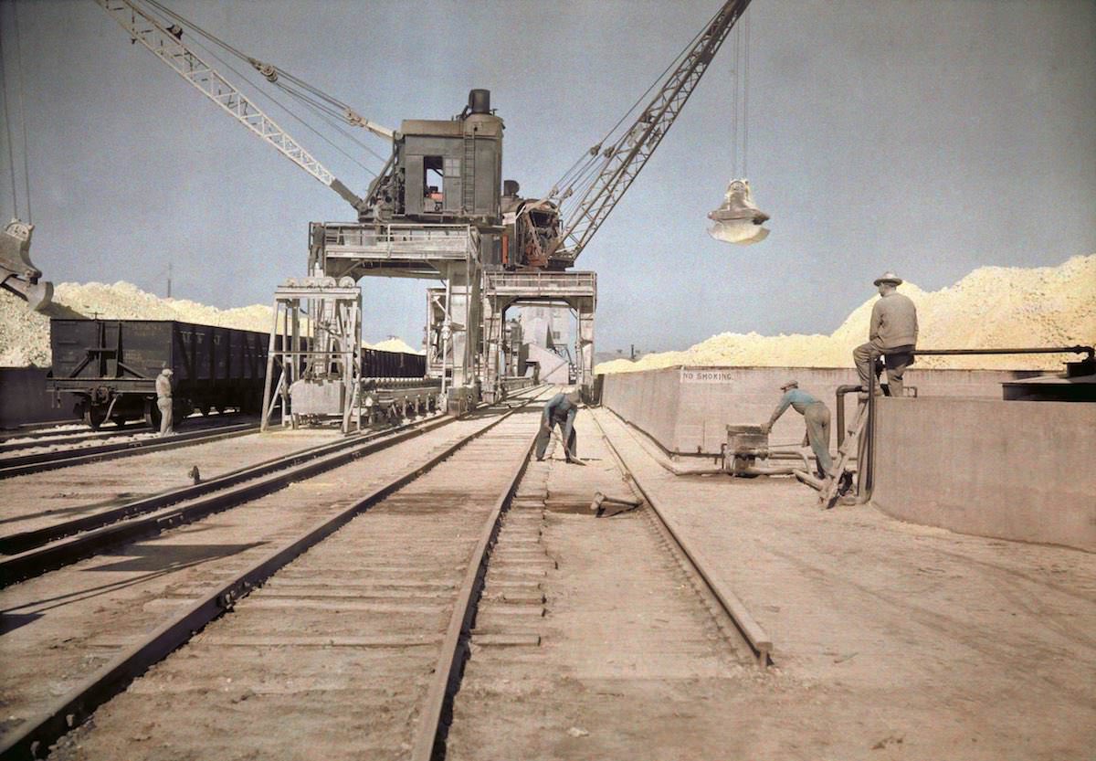 #45 Men load bins with sulfur, Galveston, TX.